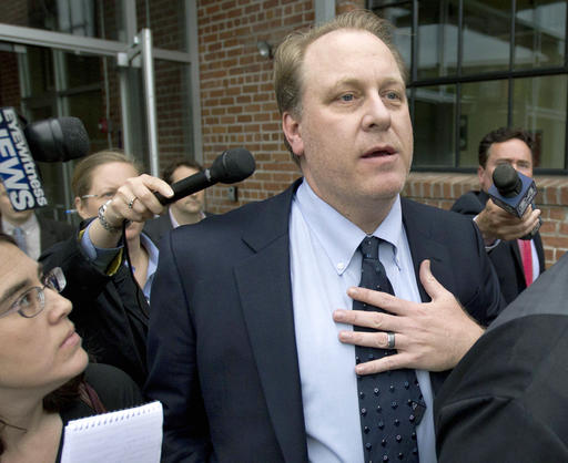 FILE - In this Wednesday, May 16, 2012, file photo, former Boston Red Sox pitcher Curt Schilling, center, is followed by members of the media as he departs the Rhode Island Economic Development Corporation headquarters, in Providence, R.I. The U.S. Securities and Exchange Commission on Monday, March 7, 2016, charged Rhode Island's economic development agency and Wells Fargo with defrauding investors in the state's disastrous $75 million deal with 38 Studios, the failed video game company started by the former Red Sox pitcher. (AP Photo/Steven Senne, File)